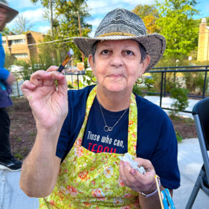 Sue Goncarovs paints children's faces at the Mason District Arts Festival on October 11, 2025.