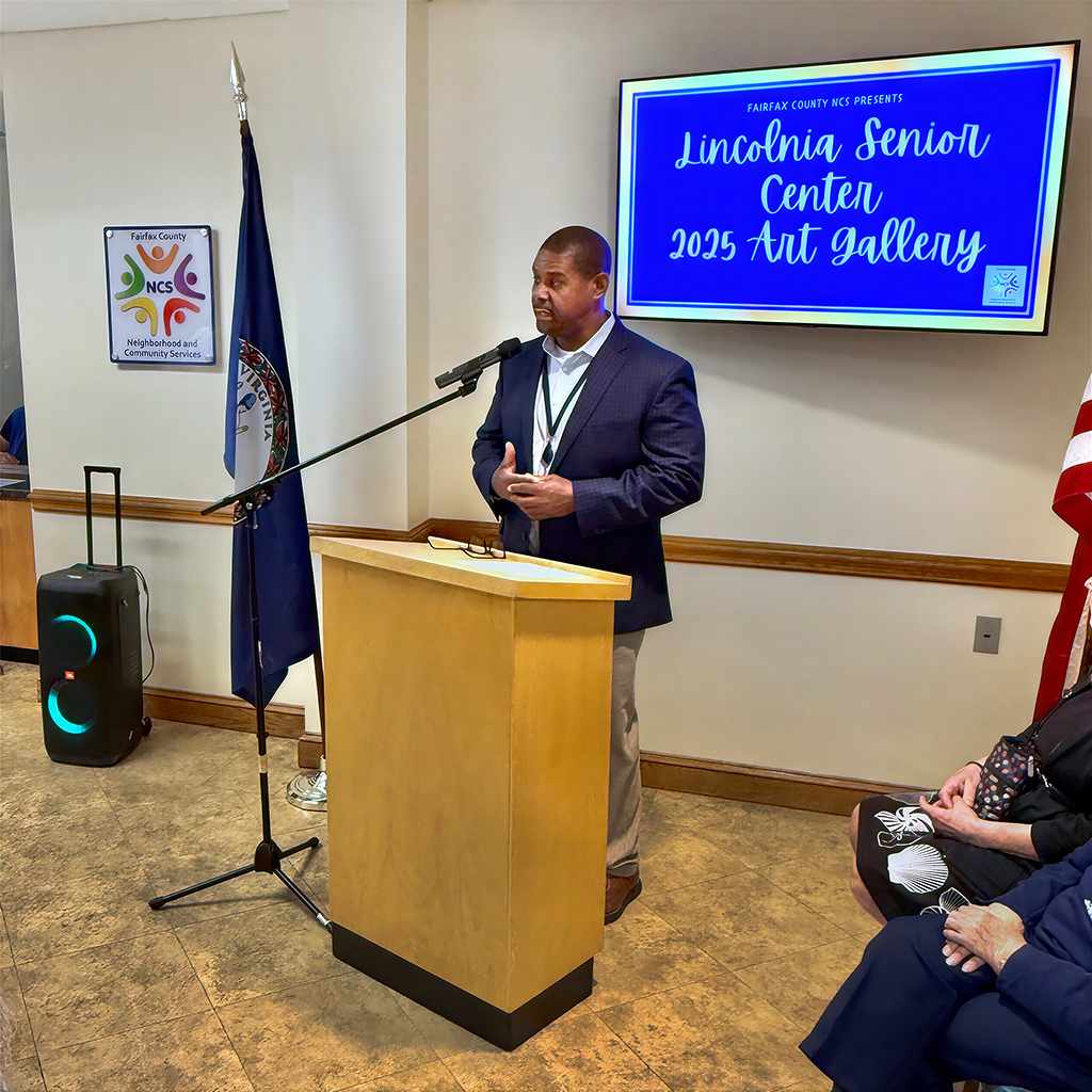 Fairfax County Neighborhood &amp; Community Services Director Lloyd Tucker welcomes attendees to the Lincolnia Senior Center art exhibit celebration and reception on May 11, 2026.