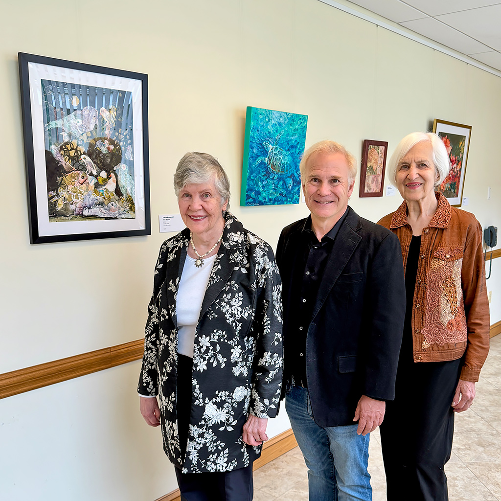 (L-R) Chica Brunsvold, David Goldstein, and Jan Barrett with their paintings at the Lincolnia Senior Center art exhibit celebration and reception on May 11, 2026.