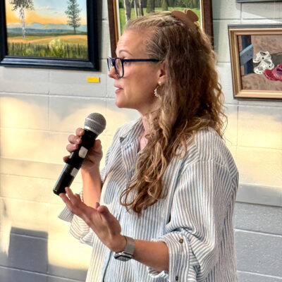 Mason District Arts Council member, Reverend Casey Wait, welcomes attendees to the Arts in Daily Spaces exhibit opening and concert in cooperation with the Mason District Arts Council on May 9, 2026 at John Calvin Presbyterian Church at 6531 Columbia Pike, in Annandale, VA.