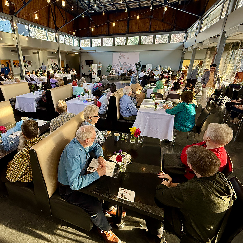Attendees enjoy short concert by Afghan musicians during Nowruz celebration on March 21, 2026 at John Calvin Presbyterian Church in Annandale, VA.