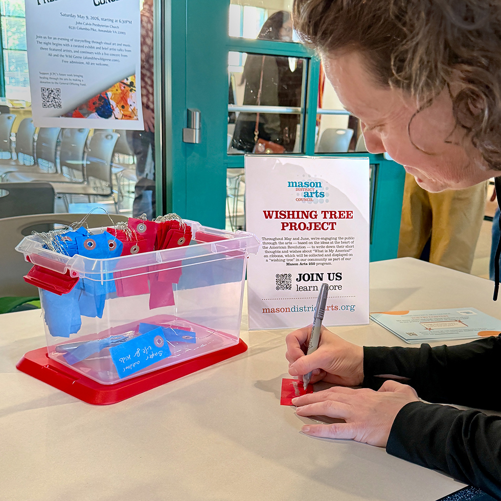 Attendee filling in their wish for America in the next 250 years during an event the Mason District Governmental Center in Annandale, VA, on May 1, 2026.
