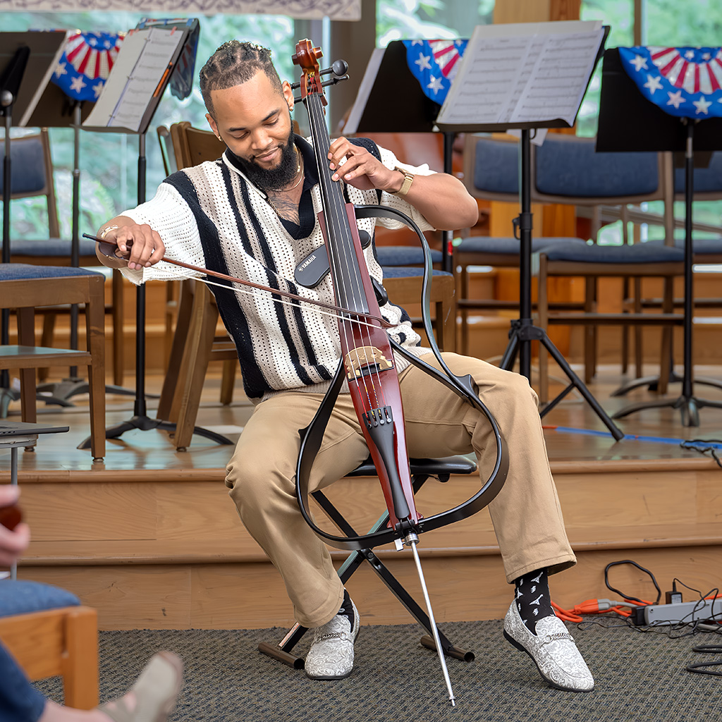 Mark Evans, Jr. also known as Maestro The Cellist, performs "Interstellar" for an audience of nearly 100 at the concert.