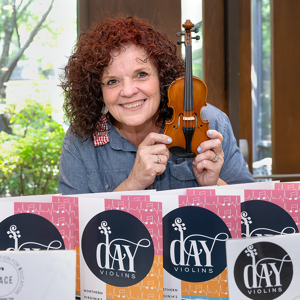 Jenna Day from Day Violins hosted a string instrument "petting zoo" for kids prior to the concert.