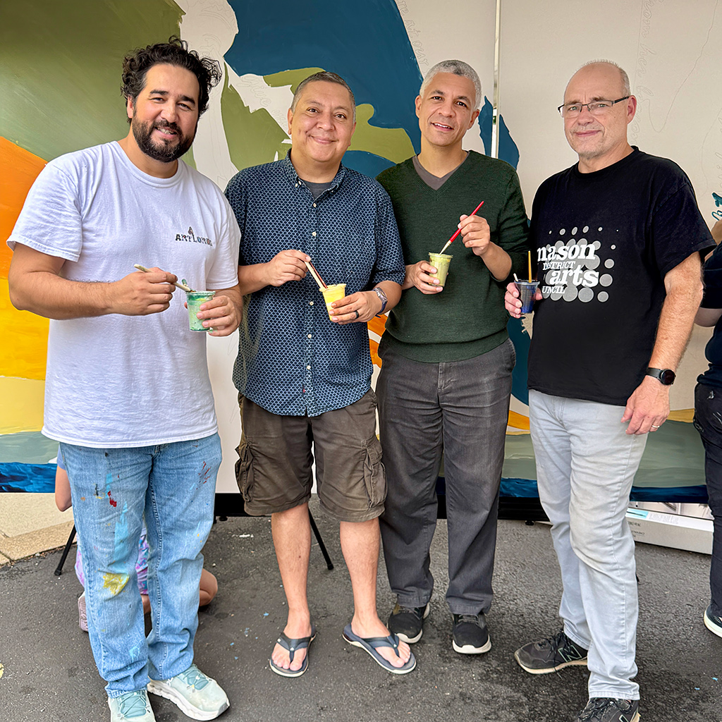 Omaid Sharifi, President of ArtLords; current Mason District Supervisor Andres Jimenez; Devin Pharr, Chief of Staff for Supervisor Jimenez; and Mason District Arts Council chair James Albright, during the community mural project and Wishing Tree event staged as part of the Mason Arts 250 series of activities to commemorate America's 250 founding anniversary.