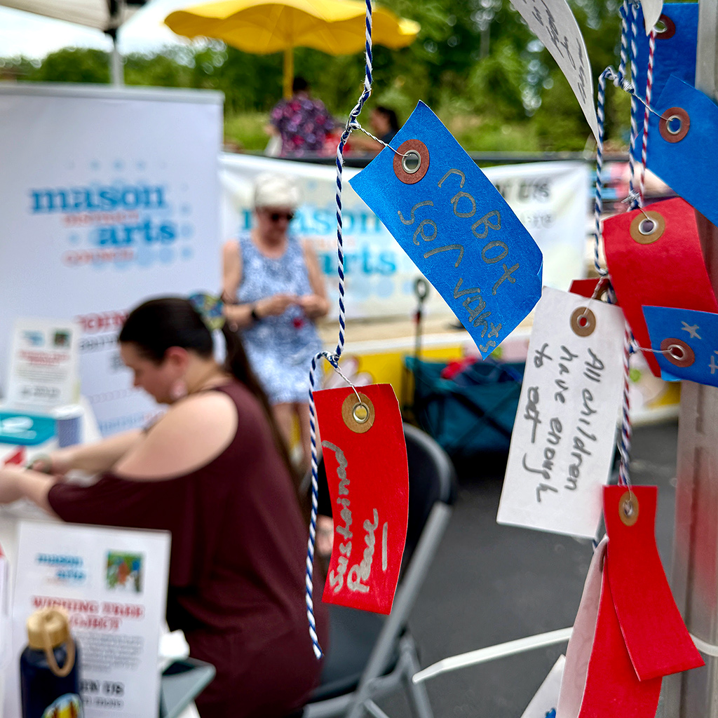 Mason District Arts Council Wishing Tree tags being collected and tied to string as part of the Mason Arts 250 series of activities to commemorate America's 250 founding anniversary.